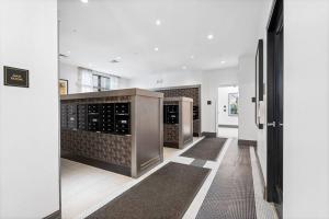 a room with a wine cellar with wine cabinets at Supreme 2 Bedroom Condo in Prime Jersey City in Jersey City