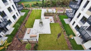 an aerial view of a garden between two buildings at Apartament Park Chorzów, FV, parking podziemny, zamknięte osiedle in Chorzów