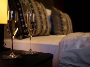 Postel nebo postele na pokoji v ubytování Grey Hotel Kopaonik