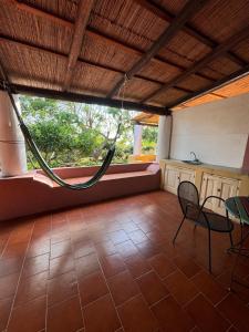 a room with a table and chairs and a window at Villa La Rosa in Filicudi +139 photos
