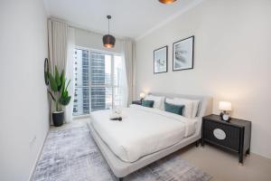 Rúm í herbergi á StayShort - Exceptional 1bedroom apartment in the heart of Downtown