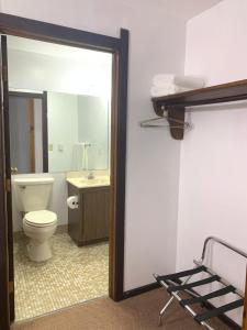 A bathroom at Bridge Inn Tomahawk - Room 107, 2 Queen Beds, Pet Friendly, Laminate Wood Flooring , Walkout, River View