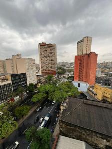 a city with tall buildings and a street with cars at Studio Friends - Centro BH - Ótima localização in Belo Horizonte