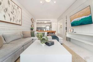 a living room with a couch and a table at New Condo With 2BR in San Lucas in Cabo San Lucas