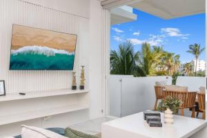 a living room with a view of the ocean at New Condo With 2BR in San Lucas in Cabo San Lucas