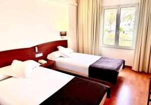 A bed or beds in a room at Arriadh