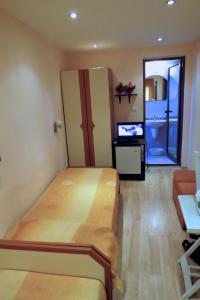 A bed or beds in a room at Family Hotel Lebed