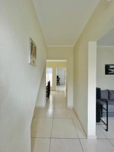 a hallway of a house with white walls at Casa aconchegante em São João del Rei in São João del Rei +48 photos