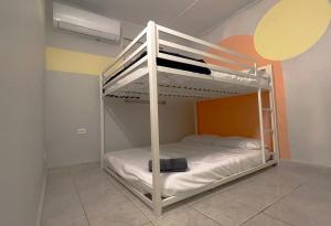 a bunk bed room with a white bunk bed at Relaxing Retreat for 5 Close to Beach & Airport in Carolina