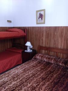 Postel nebo postele na pokoji v ubytování Mi casita de la suerte