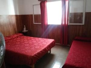 Postel nebo postele na pokoji v ubytování Mi casita de la suerte