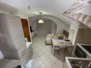 a room with a bed and a table in it at Il Segreto in Putignano