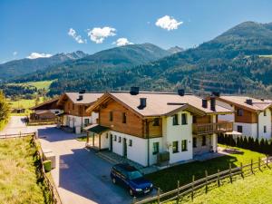 an aerial view of a house with mountains in the background at Chalet Lengberg B1 in Niedernsill