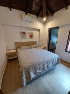 Кровать или кровати в номере BauHouse Comfort Suites Asuncion