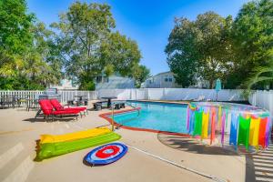 a swimming pool with a pool noodle at 1 Mi to Beach and Hot Tub Murrells Inlet Retreat! in Myrtle Beach