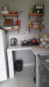 a kitchen with a counter with pots and pans on it at Casa Quinta en Pilar, Ñeembucú in Pilar