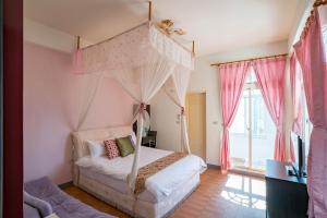 Postel nebo postele na pokoji v ubytování Hualien Travel
