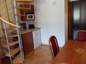 Kuchyň nebo kuchyňský kout v ubytování Apartments Sunce