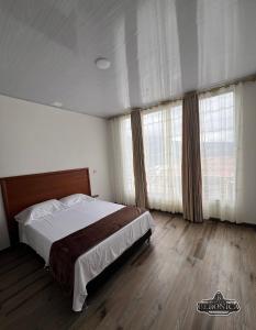Postel nebo postele na pokoji v ubytování Hotel Beronica