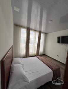 Postel nebo postele na pokoji v ubytování Hotel Beronica