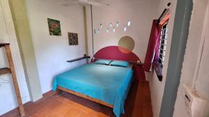 Postel nebo postele na pokoji v ubytování Dragonfly Guesthouse M'Pai Bay