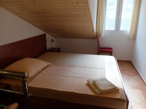 Postel nebo postele na pokoji v ubytování Apartments Sunce