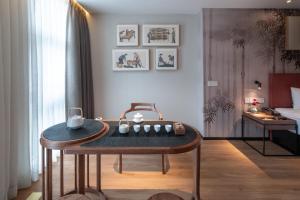 Posezení v ubytování 重庆文里苗品茶艺术酒店Chongqing Jiangbei Airport Creative Park Store