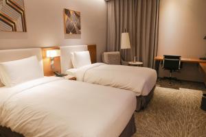 Hotel Skypark Central Seoul Pangyo房間的床