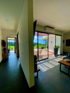 a living room with a view of a patio at Balisen Luxury Villas in Jasri