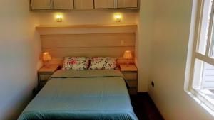 Katil atau katil-katil dalam bilik di Apartamento com 2 dormitórios no Centro Histórico de São Paulo