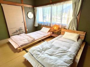 漁師宿三浦屋秀栄丸客房内的一张或多张床位