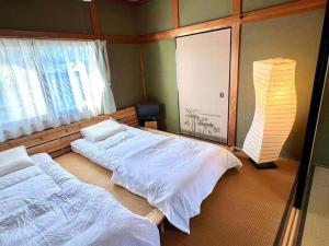 漁師宿三浦屋秀栄丸客房内的一张或多张床位