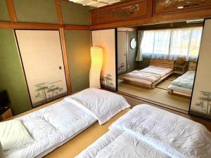 漁師宿三浦屋秀栄丸客房内的一张或多张床位