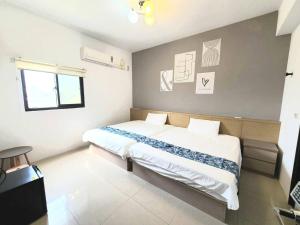 Postelja oz. postelje v sobi nastanitve New Summer Homestay