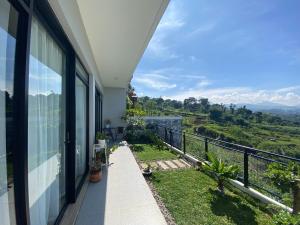a balcony of a house with a view at Casa Revanaka Ciumbuleuit Bandung in Bandung