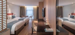 Postel nebo postele na pokoji v ubytování 重庆文里苗品茶艺术酒店Chongqing Jiangbei Airport Creative Park Store