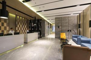 Posezení v ubytování Echarm Hotel Foshan Qianqiu Xiqiao Mountain Scenic Area Shop