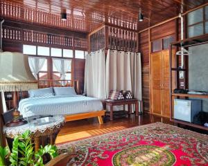 Postel nebo postele na pokoji v ubytování Bannai Bangkoknoi บ้านในบางกอกน้อย