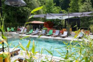 a swimming pool with lounge chairs and a gazebo at Guest House Valevtsi in Valevtsi
