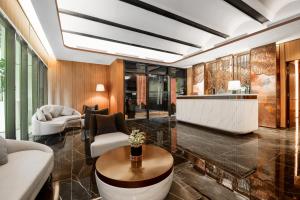 a living room with a couch and a table at Atelier KLCC in Kuala Lumpur