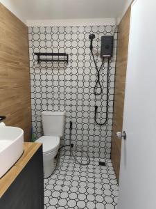 a bathroom with a toilet and a shower at Seaview Home Samet in Ko Samed +17 photos