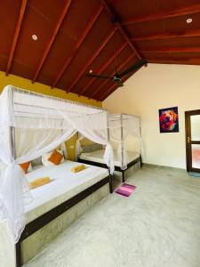 Letto o letti in una camera di Mango Tree House