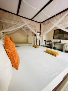 Letto o letti in una camera di Mango Tree House