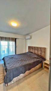a bedroom with a large bed in a room at Granari Luxury Maisonette Nikiti in Nikiti