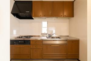 Dapur atau dapur kecil di ジブリパークまで車10分 遊べるキッズハウス1棟貸切り 敷地内無料駐車場あり 最大12名
