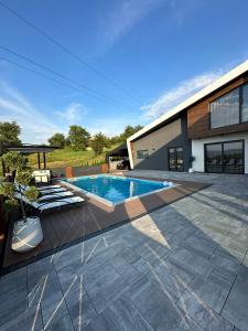 a swimming pool in the backyard of a house at Villa 4A Visoko in Visoko