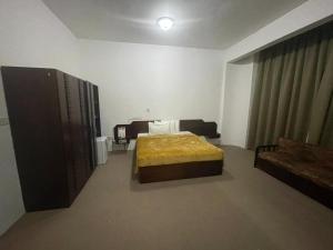 Postel nebo postele na pokoji v ubytování فندق ظفار Dhofar HOTEL