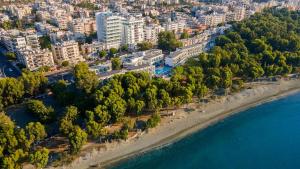 an aerial view of a city with a beach and water at Park Beach Hotel in Limassol