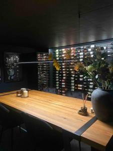 a wooden table with a potted plant on top of it at Luxurious villa - exceptional location in city center with free P in Odense