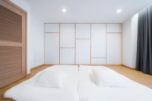 Postel nebo postele na pokoji v ubytování Davin Hotel